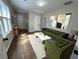 Bright living room showcases hardwood floors, eye-catching artwork, and comfortable green seating at 1929 Hazelwood Se Dr, Marietta, GA 30067