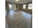 Bright and airy living room showcasing neutral walls, tile floors, and ample natural light from the windows at 1929 Hazelwood Se Dr, Marietta, GA 30067