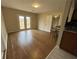 Bright living room with hardwood floors, neutral paint, french doors, and access to a kitchen bar at 1929 Hazelwood Se Dr, Marietta, GA 30067