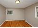 Empty bedroom with hardwood floors, neutral paint, and natural light at 2458 Haverford Way, Decatur, GA 30032