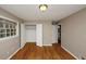 Bedroom features hardwood floors, neutral paint, closet, and natural light at 2458 Haverford Way, Decatur, GA 30032