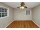 Bedroom with hardwood floors, neutral paint, ceiling fan, and natural light at 2458 Haverford Way, Decatur, GA 30032