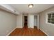 This bedroom boasts hardwood floors, a closet, and natural light from the window at 2458 Haverford Way, Decatur, GA 30032