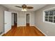 Bedroom features hardwood floors, neutral paint, and two doorways at 2458 Haverford Way, Decatur, GA 30032