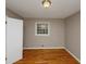Bedroom features hardwood floors, neutral paint, and natural light at 2458 Haverford Way, Decatur, GA 30032