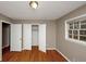 Bedroom features hardwood floors, closet, and natural light at 2458 Haverford Way, Decatur, GA 30032