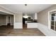 Open floor plan featuring a dining room with modern lighting and durable floors at 2458 Haverford Way, Decatur, GA 30032