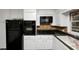Kitchen features modern appliances, granite countertops, and tile backsplash at 2458 Haverford Way, Decatur, GA 30032