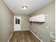 A well-lit mudroom features a door to the outside and convenient overhead storage at 2458 Haverford Way, Decatur, GA 30032