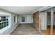 Sunroom with brick accents, lots of windows and exterior access at 2458 Haverford Way, Decatur, GA 30032