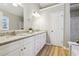 Bathroom featuring granite countertops, double sinks, and cabinets at 20 Trace Ct, Covington, GA 30016