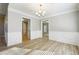 Elegant dining room featuring chandelier lighting and wainscoting at 20 Trace Ct, Covington, GA 30016