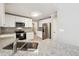 Kitchen with stainless steel appliances, granite countertops, and white cabinetry at 20 Trace Ct, Covington, GA 30016