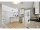 Modern kitchen featuring granite countertops, stainless steel appliances, and an open concept design at 20 Trace Ct, Covington, GA 30016
