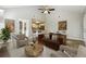 Open floor plan living room with modern furniture and kitchen in the background at 20 Trace Ct, Covington, GA 30016