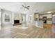 Open concept living room with fireplace, kitchen, vaulted ceilings and natural light at 20 Trace Ct, Covington, GA 30016