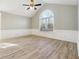 Vaulted ceiling and large window in a neutral living room with decorative trim at 20 Trace Ct, Covington, GA 30016