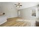 Sun-drenched living room features vaulted ceiling and a sliding door to the backyard at 20 Trace Ct, Covington, GA 30016