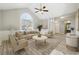 Bright living room featuring a large window, vaulted ceiling, and modern furnishings at 20 Trace Ct, Covington, GA 30016