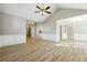 Open floor plan living room with decorative trim, high ceilings, and wood-look floors at 20 Trace Ct, Covington, GA 30016