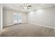 Spacious bedroom with trey ceiling, recessed lighting and french doors to outside at 20 Trace Ct, Covington, GA 30016