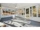 Bright sunroom with screened windows and ceiling fan at 20 Trace Ct, Covington, GA 30016