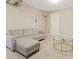 Finished basement area featuring comfortable seating, neutral decor, and a round glass table at 4064 Chimney Ridge Way, Ellenwood, GA 30294