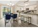 Open concept dining and kitchen area with access to an outdoor deck, perfect for entertaining at 4064 Chimney Ridge Way, Ellenwood, GA 30294