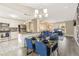 Bright dining area connected to the kitchen, with blue chairs and modern finishes at 4064 Chimney Ridge Way, Ellenwood, GA 30294