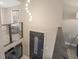 Inviting entryway featuring a modern chandelier and stylish front door at 4064 Chimney Ridge Way, Ellenwood, GA 30294