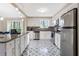 Modern kitchen with granite countertops, stainless steel appliances, and stylish tile flooring at 4064 Chimney Ridge Way, Ellenwood, GA 30294