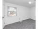 Simple bedroom with grey carpet and window at 7771 Mattie Mccoy Ln, Winston, GA 30187
