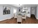 Dining area with hardwood floors and kitchen access at 7771 Mattie Mccoy Ln, Winston, GA 30187