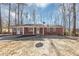 Brick ranch house with a spacious yard and driveway at 7771 Mattie Mccoy Ln, Winston, GA 30187