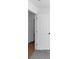 Simple hallway with hardwood floor and white doors at 7771 Mattie Mccoy Ln, Winston, GA 30187