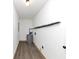 Laundry area with vinyl flooring and water heater at 7771 Mattie Mccoy Ln, Winston, GA 30187