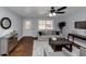 Bright living room with hardwood floors and comfy seating at 7771 Mattie Mccoy Ln, Winston, GA 30187