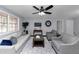 Living room with hardwood floors and ceiling fan at 7771 Mattie Mccoy Ln, Winston, GA 30187