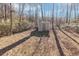 Small storage shed in wooded backyard at 7771 Mattie Mccoy Ln, Winston, GA 30187