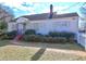 White single story house with red steps and landscaping at 153 Hill St, Roswell, GA 30075