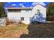 Back of house, showing screened porch and yard at 153 Hill St, Roswell, GA 30075