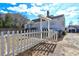 White house with a picket fence and pergola at 153 Hill St, Roswell, GA 30075