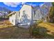 Side view of a white house with a yard at 153 Hill St, Roswell, GA 30075