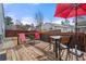 Charming back deck with outdoor seating, an umbrella, and a wooden fence at 2425 Park Ave, Austell, GA 30106