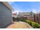 View of the backyard with a charming back deck and privacy fence at 2425 Park Ave, Austell, GA 30106