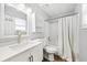 Bright bathroom featuring white vanity, shower and modern fixtures at 2425 Park Ave, Austell, GA 30106