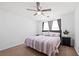 Comfortable bedroom features a ceiling fan, neutral carpet and ample natural light at 2425 Park Ave, Austell, GA 30106