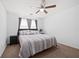 Cozy bedroom with ceiling fan, comfortable queen bed and neutral carpeting at 2425 Park Ave, Austell, GA 30106