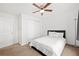 Bright bedroom featuring neutral carpet, closet, and a ceiling fan at 2425 Park Ave, Austell, GA 30106