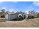 Gray siding house with a white door and landscaping at 2425 Park Ave, Austell, GA 30106